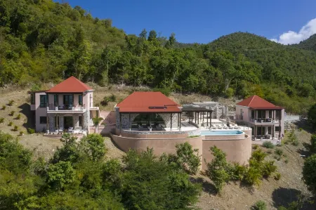 Walk to world famous Maho Bay! Privacy, views, pool, 4 equal king size bedrooms.