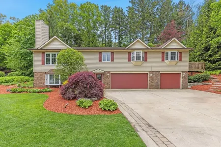 Ideal Lakeshore location in serene wooded landscape with waterfalls.