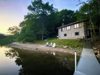 Lakefront cabin with dock, hot tub, fire pit!!