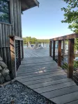 Cozy waterfront log cottage with huge outdoor living area.