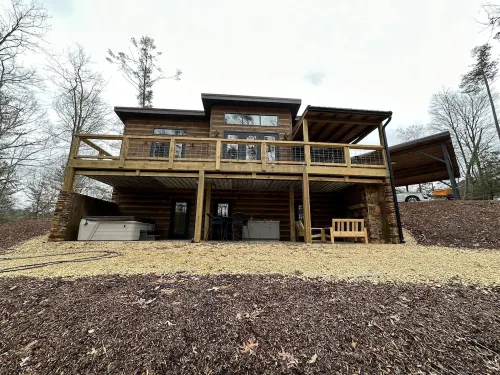 Luxury cabin in county but not far from downtown. Hot tub on back porch.