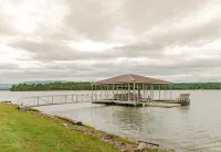 "LAKE HOUSE" On 7 Acres Of Douglas Lake With A Private Boat Ramp & Private Dock!