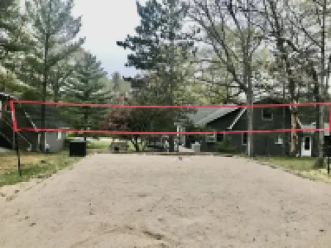 The Gray Escape Steps away from Lake Margrethe Hotels in Grayling Township