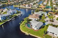 SENSATIONAL!! WATER-VIEW, LUXURY REMODEL, SUNNY HEATED POOL, HUGE 145’ SEA WALL