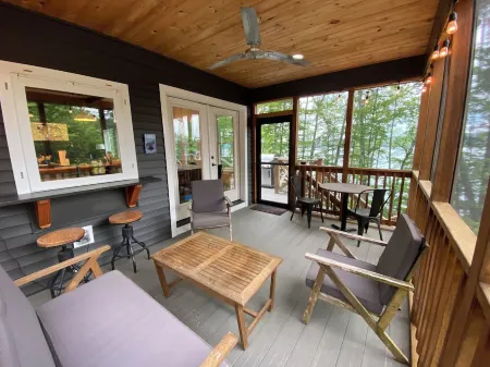 Beautiful new modern cabin with 100 feet of shoreline on Long Lake