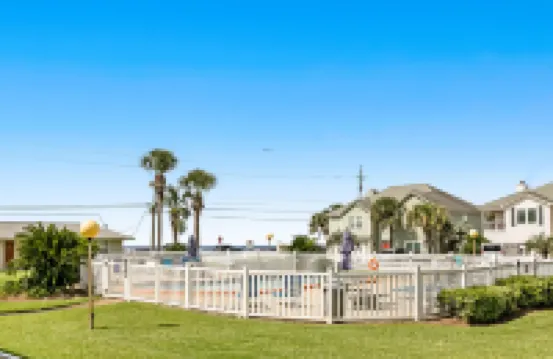 Pool view condo with free WiFi, central ac, private w/d, & shared pool