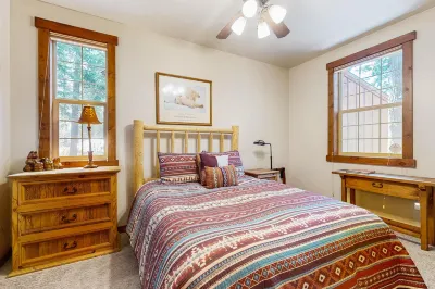 Tree-lined home with forest views & wood stove - right on the golf course