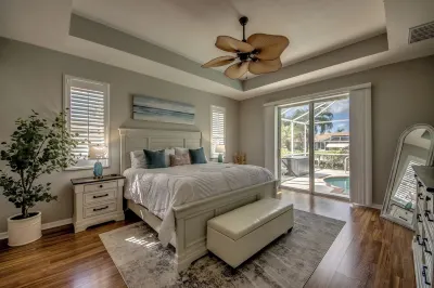 Spacious waterfront villa w 2 master suites, a junior suite, heated pool and spa