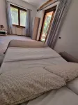 2 DOUBLE BEDS, MINI FRIDGE, COFFEE MACHINE, MICROWAVE OVEN, TABLE.