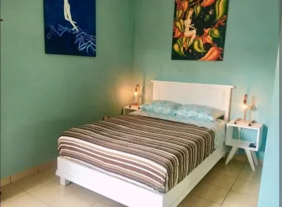 An amazing apartment with green area, garden with teable and chairs in the best
