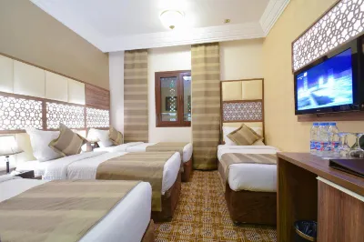 Golden Tulip Al-Zahabi Отели в г. 