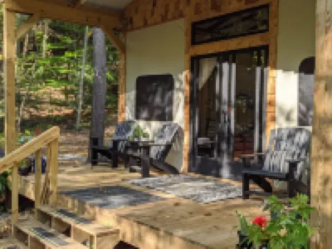 Custom Design Safari Tent Overlooking a Serene Running Creek & Natural Waterfall