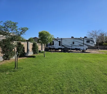 Cozy RV tucked back in a quiet property with plenty of room to relax
