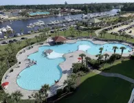 Modern Golf-View Condo • Barefoot Resort • Pools • Beach Gear Included