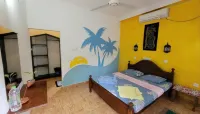 Malika's Yellow House
