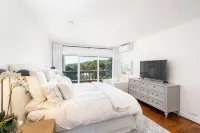 Malibu 2-bedroom designer furnished condo with AC. Central to everything!