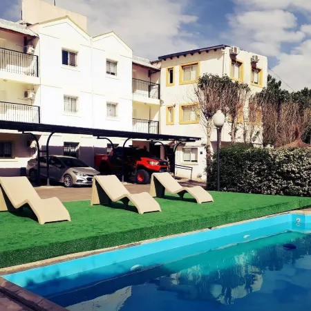 Apart Hotel Pueblo Viejo Отели рядом с достопримечательностью «Госпиталь Росон»