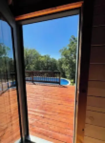 Real Log Cabin with Seasonal Pool and Hot Tub near Blue Springs Ranch