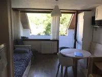 Studio with sleeping area for small family.