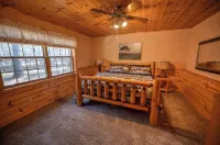 Exceptional log home on 9+ acres with frontage on Big St. Germain Lake