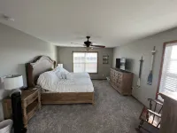 Country home with lake access and game room.