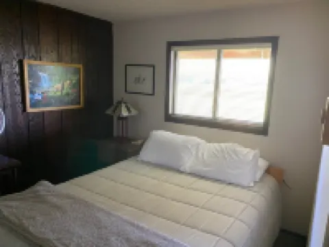 A wonderful, secluded 2 story cabin, deck, fire pit, stocked pond for fishing.