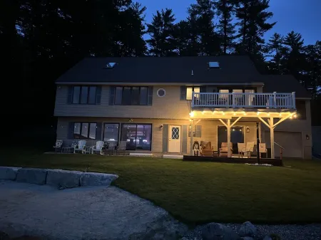 A quiet cove, the sunset and a sandy beach, on Lake Winnipesaukee