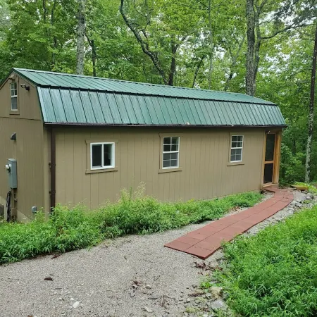 Pet friendly cottage on 17 acre Lake front property with dock and kayak access