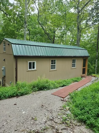 Pet friendly cottage on 17 acre Lake front property with dock and kayak access