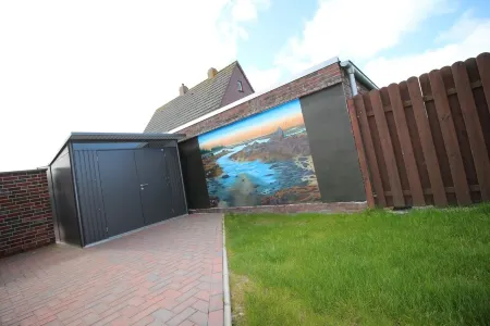 Modern first floor apartment with sauna and beach chair in the garden for 4 persons Отели в г. Норден