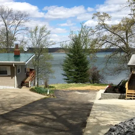 Experience Kentucky Lake out the back door! Spacious 4-bedroom retreat awaits.