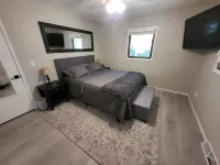 Spacious 4-bedroom house on 1 acre, fenced, GAME ROOM, and party tent rental!
