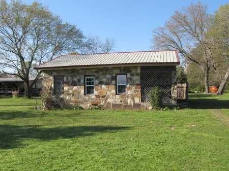 Restored rock house with hot tub and beautiful private deck.