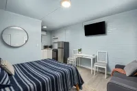 Kitchenette and Cozy Patio Area - Stylish Coastal Retreat Hotels in Rockaway Beach