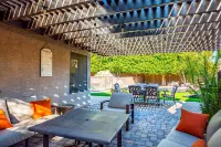 Expansive Backyard Oasis with Pool and Waterslide - Inviting Escape