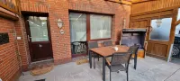 Garden apartment B with private terrace in Tossens