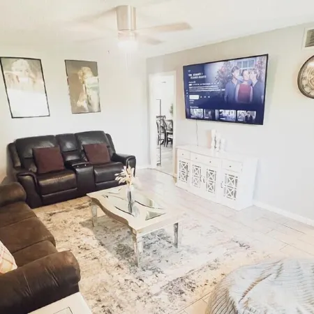 Beautiful Home in quiet neighborhood with a pool and close to stores & highways.