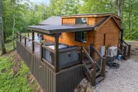The Mighty Acorn, Bungalow is a delightful cozy tiny home in the woods.