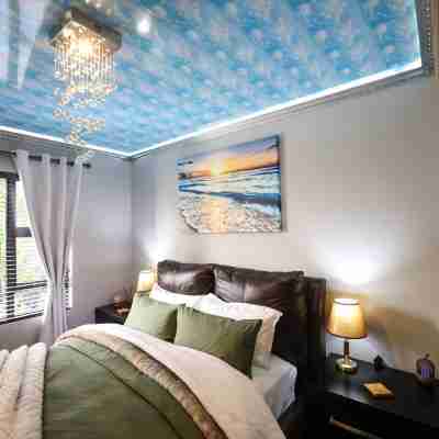 Luxury 2-Bedroom Apartment Near or Tambo with Private Garden & Heated Pool Rooms
