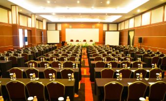 a large conference room filled with rows of chairs and tables , ready for a meeting or event at Sari Ater Kamboti Hotel Bandung