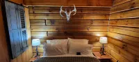Enjoy a Hot Tub and a peaceful Cabin out in the country at High Ridge Cabins.