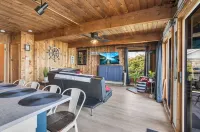 Cozy 3BR lakefront cottage with hot tub perfect for families w/ private dock.