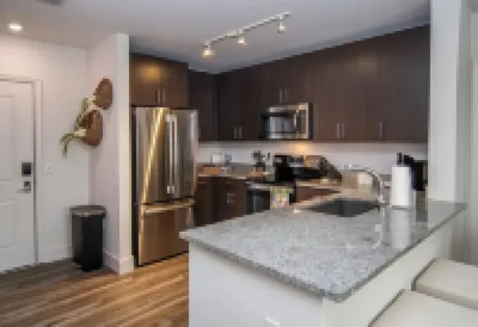 Walk to the square and the grove! This 2BR 2BA is the perfect location.