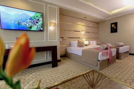 Cairo Taj Mohandessn Hotels & Suites Отели рядом с достопримечательностью «Каирский университет»