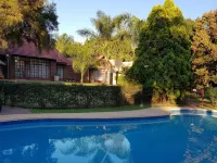 Falling Feather Inn Hotels near Waltloo Train Station