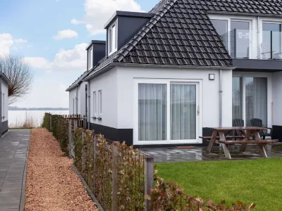 Apartment Sneekermeer with Water Sports Access Hotels in 