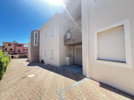 Villasimius: La Chiocciola apartment Surrounded by greenery.