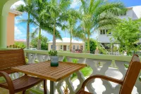 Two bedroom, 2 bathroom house in a tropical palm and garden setting.