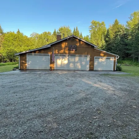 Spacious five-bedroom home off Back Lake with direct trail access on Spooner Rd