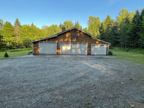 Spacious five-bedroom home off Back Lake with direct trail access on Spooner Rd